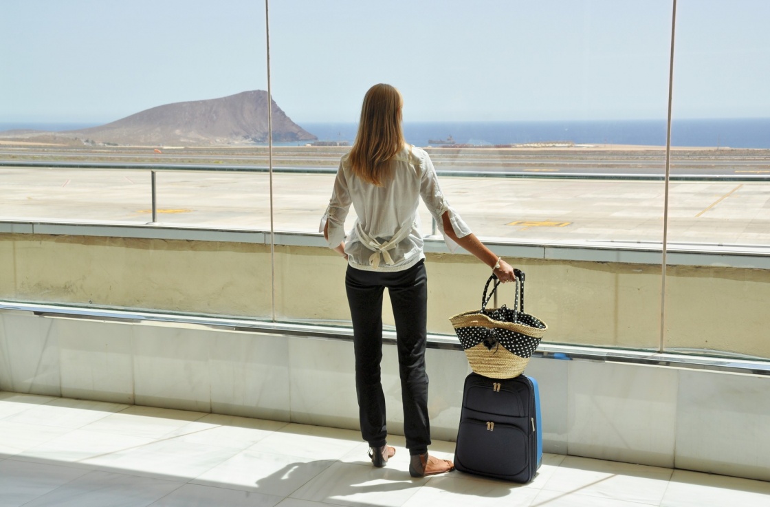 'Girl at the airport window looking to the Atlantic ocean. Tenerife, Canaries' - Tenerife