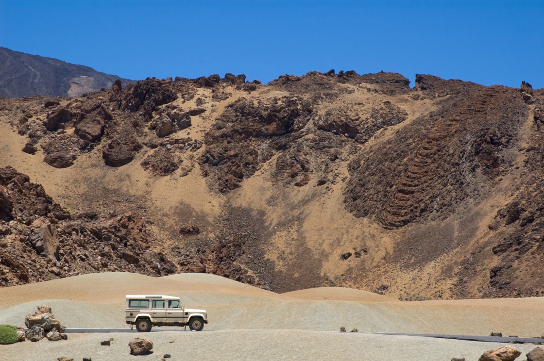 jeep between lava-stone